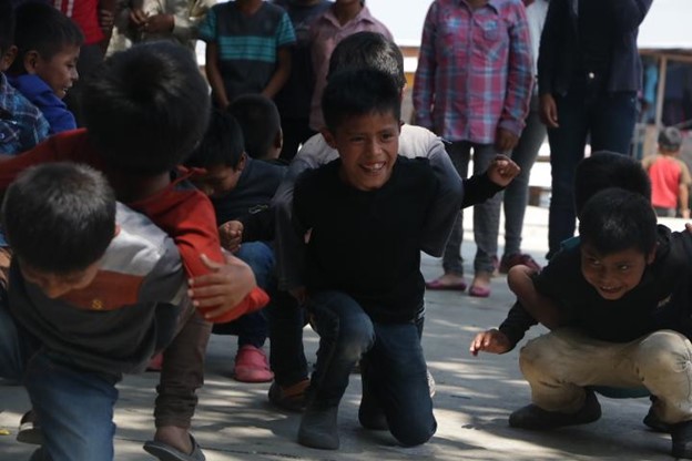 Group of young people practicing dance and playing