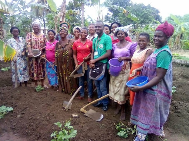 Group of villagers in their vegetable garden