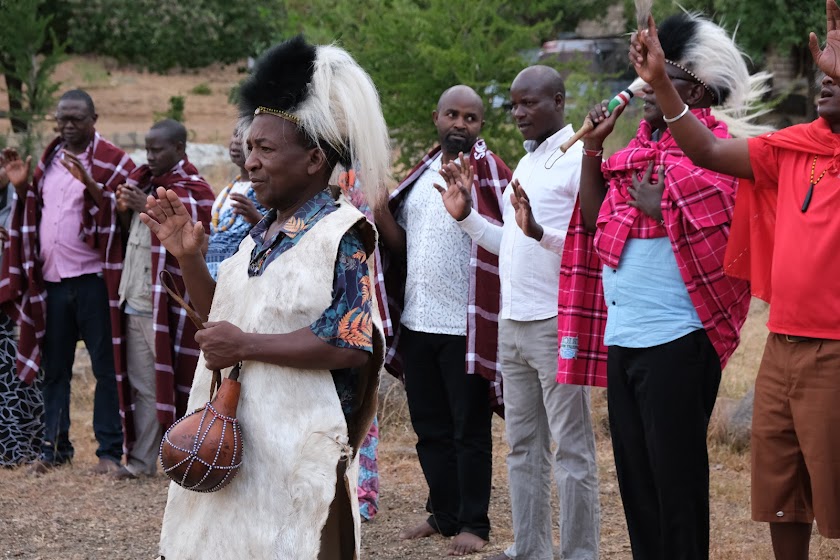 Members of the community performing a blessing ritual.
