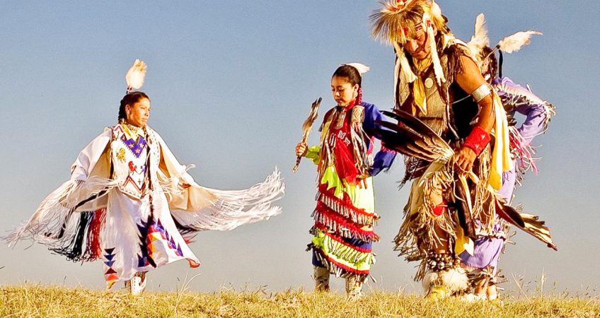 Image of Lakota Sioux dancers in traditional dress. 